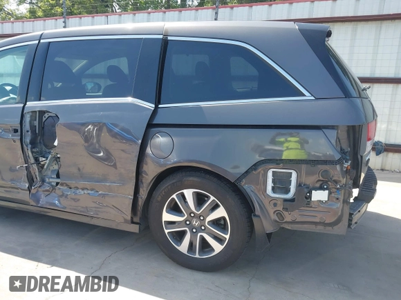 2014 Honda Odyssey Touring with VIN 5FNRL5H99EB075979, listed as a IAAI auction lot 42520154 with 99,314 mi miles and . Bid and sale history available at DreamBid. Image 18.