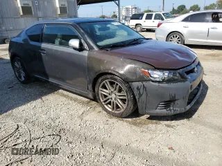 2012 Scion tC z VIN JTKJF5C70C3034928, wystawiony jako Copart lot #61272465 z przebiegiem 183 054 mil mil oraz Szkoda całkowita • Salvage title. Historia ofert i sprzedaży dostępna na DreamBid. Obrazek 4.