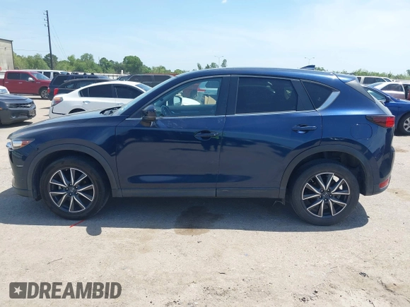 2018 Mazda CX-5 Touring z VIN JM3KFACM7J1410275, wystawiony jako IAAI lot #42248830 z przebiegiem 101 125 mil mil oraz . Historia ofert i sprzedaży dostępna na DreamBid. Obrazek 14.