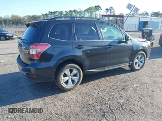 2014 Subaru Forester 2.5i Touring with VIN JF2SJAMC1EH452856, listed as a IAAI auction lot 41801406 with 148,342 mi miles. Bid and sale history available at carsss.com. Image 4.