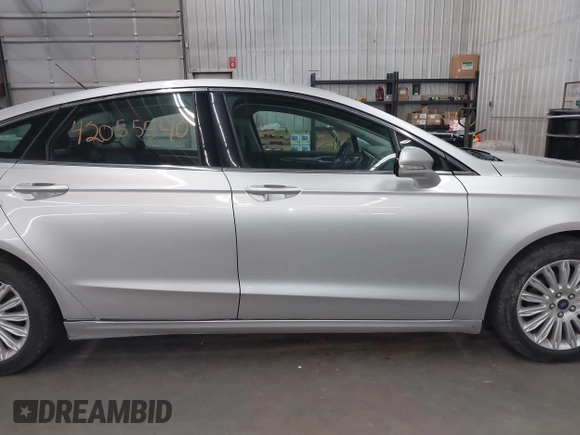 2013 Ford Fusion SE Hybrid with VIN 3FA6P0LU7DR228691, listed as a IAAI auction lot 42055540 with 144,389 mi miles and . Bid and sale history available at DreamBid. Image 13.