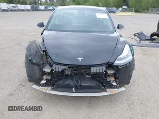 2019 Tesla Model 3 Mid Range with VIN 5YJ3E1EA6KF415656, listed as a IAAI auction lot 42140763 with 71,408 mi miles and . Bid and sale history available at carsss.com. Image 6.