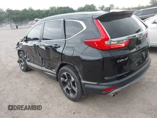 2017 Honda CR-V Touring with VIN 2HKRW2H96HH672017, listed as a IAAI auction lot 42151118 with 144,527 mi miles and . Bid and sale history available at carsss.com. Image 3.