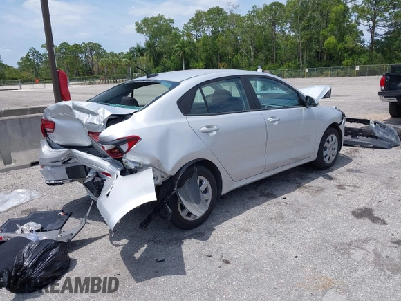 2023 Kia Rio S z VIN 3KPA24AD4PE604207, wystawiony jako IAAI lot #42077201 z przebiegiem 16 559 mil mil oraz . Historia ofert i sprzedaży dostępna na DreamBid. Obrazek 4.