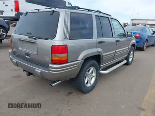 1998 Jeep Grand Cherokee Limited with VIN 1J4GZ88Z6WC307986, listed as a IAAI auction lot 41539972 with 150,652 mi miles. Bid and sale history available at carsss.com. Image 4.