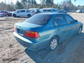 1999 Honda Civic DX with VIN 2HGEJ662XXH504884, listed as a IAAI auction lot 41894914 with 114,888 mi miles. Bid and sale history available at carsss.com. Image 4.