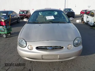 1999 Ford Taurus SE with VIN 1FAFP53U4XG223246, listed as a IAAI auction lot 41570969 with 59,064 mi miles. Bid and sale history available at carsss.com. Image 6.
