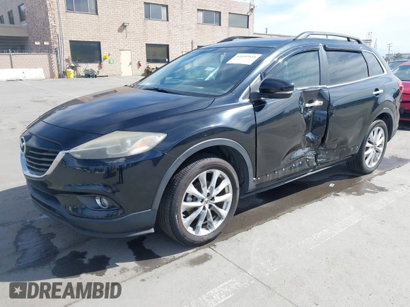 2015 Mazda CX-9 Grand Touring z VIN JM3TB2DA4F0450014, wystawiony jako IAAI lot #41692935 z przebiegiem 90 800 mil mil oraz . Historia ofert i sprzedaży dostępna na DreamBid. Obrazek 2.