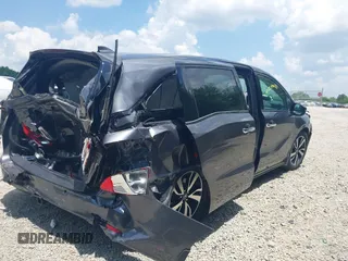2018 Honda Odyssey Elite with VIN 5FNRL6H95JB087952, listed as a IAAI auction lot 42579817 with 96,577 mi miles and . Bid and sale history available at DreamBid. Image 4.