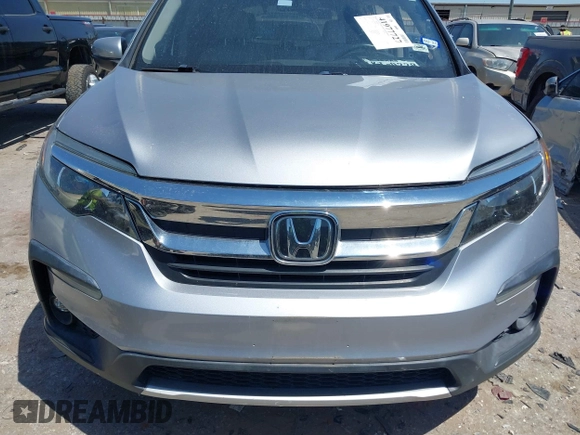 2019 Honda Pilot EX-L with VIN 5FNYF5H58KB040331, listed as a IAAI auction lot 41977727 with 90,655 mi miles and . Bid and sale history available at DreamBid. Image 12.