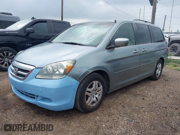 2005 Honda Odyssey EX with VIN 5FNRL38415B104920, listed as a IAAI auction lot 42094690 with 228,538 mi miles. Bid and sale history available at carsss.com. Image 2.