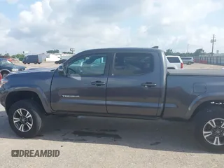 2018 Toyota Tacoma SR5 with VIN 3TMDZ5BN0JM051283, listed as a IAAI auction lot 42438690 with 106,155 mi miles and . Bid and sale history available at DreamBid. Image 14.
