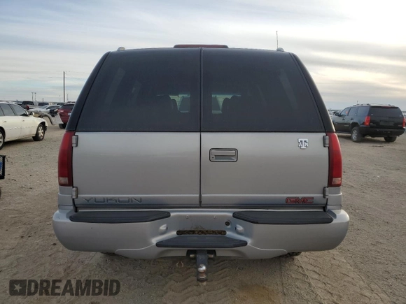 2000 GMC Denali z VIN 1GKEK63R9YR225073, wystawiony jako Copart lot #86819964 z przebiegiem 207 827 mil mil oraz Szkody całkowita. Historia ofert i sprzedaży dostępna na DreamBid. Obrazek 6.