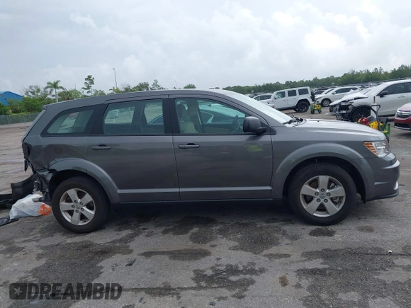2013 Dodge Journey SE with VIN 3C4PDCAB6DT529949, listed as a IAAI auction lot 42609006 with 38,202 mi miles and . Bid and sale history available at DreamBid. Image 14.
