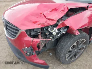 2016 Mazda CX-5 Grand Touring z VIN JM3KE4DY7G0687318, wystawiony jako IAAI lot #42228585 z przebiegiem 188 793 mil mil oraz . Historia ofert i sprzedaży dostępna na DreamBid. Obrazek 6.
