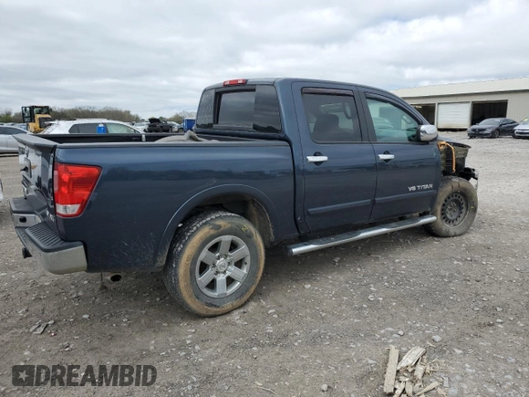 2015 Nissan Titan SV with VIN 1N6AA0EC9FN500624, listed as a Copart auction lot 50982985 with 128,976 mi miles and Salvage title. Bid and sale history available at DreamBid. Image 3.