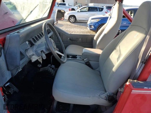 1991 Jeep Wrangler z VIN 2J4FY19P6MJ107521, wystawiony jako Copart lot #84077214 z przebiegiem 1 311 216 mil mil oraz Czysty tytuł • Clean title. Historia ofert i sprzedaży dostępna na DreamBid. Obrazek 7.