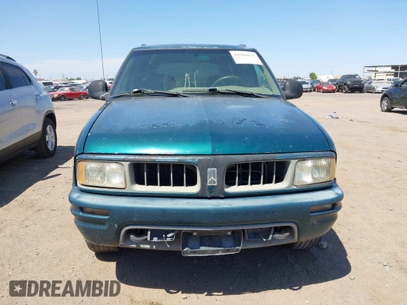 1996 Oldsmobile Bravada z VIN 1GHDT13W5T2711291, wystawiony jako IAAI lot #42502672 z przebiegiem 219 062 mil mil oraz . Historia ofert i sprzedaży dostępna na DreamBid. Obrazek 6.
