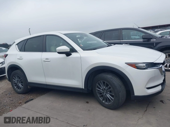 2017 Mazda CX-5 Touring z VIN JM3KFBCL5H0128584, wystawiony jako IAAI lot #42354669 z przebiegiem 56 563 mil mil oraz . Historia ofert i sprzedaży dostępna na DreamBid. Obrazek 13.