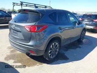 2016 Mazda CX-5 Grand Touring with VIN JM3KE2DYXG0784615, listed as a IAAI auction lot 41846853 with 72,185 mi miles. Bid and sale history available at carsss.com. Image 4.