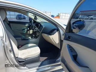 2014 Kia Optima LX with VIN KNAGM4A79E5470198, listed as a IAAI auction lot 42142484 with 169,140 mi miles. Bid and sale history available at carsss.com. Image 5.