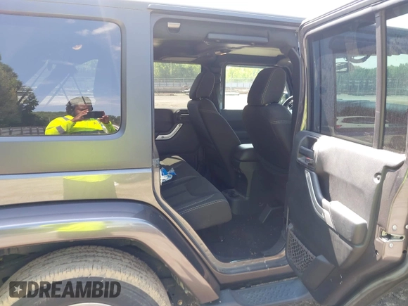 2016 Jeep Wrangler Unlimited Sahara with VIN 1C4BJWEG7GL340074, listed as a IAAI auction lot 42434763 with 81,095 mi miles and . Bid and sale history available at DreamBid. Image 8.