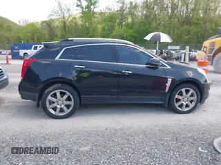 2012 Cadillac SRX Performance Collection with VIN 3GYFNEE32CS512118, listed as a IAAI auction lot 42158452 with 143,449 mi miles. Bid and sale history available at carsss.com. Image 13.
