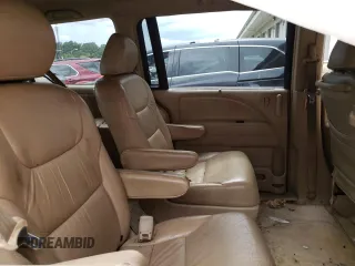 2006 Honda Odyssey EX z VIN 5FNRL38436B058444, wystawiony jako Copart lot #70381084 z przebiegiem 181 928 mil mil oraz Szkoda całkowita • Salvage title. Historia ofert i sprzedaży dostępna na DreamBid. Obrazek 11.