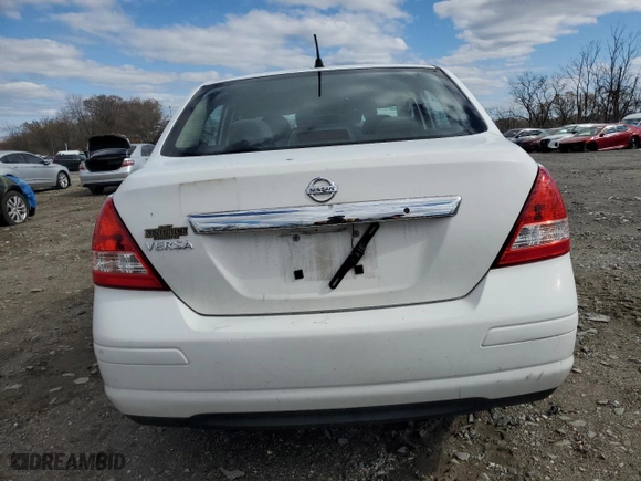 2010 Nissan Versa 1.8 S with VIN 3N1BC1AP5AL433273, listed as a Copart auction lot 49530095 with 128,769 mi miles and Salvage Title. Bid and sale history available at carsss.com. Image 6.