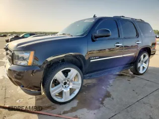 2013 Chevrolet Tahoe LTZ with VIN 1GNSCCE00DR343233, listed as a Copart auction lot 57653005 with 168,491 mi miles and Salvage title. Bid and sale history available at DreamBid. Image 1.