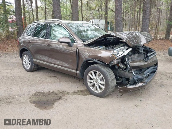 2014 Volkswagen Touareg Sport with VIN WVGEF9BP2ED007904, listed as a IAAI auction lot 41960811 with 126,230 mi miles and . Bid and sale history available at DreamBid. Image 1.