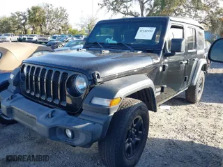 2018 Jeep Wrangler Unlimited Sport S with VIN 1C4HJXDG9JW159307, listed as a IAAI auction lot 41142193 with 57,185 mi miles. Bid and sale history available at carsss.com. Image 2.
