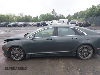 2015 Lincoln MKZ Hybrid z VIN 3LN6L2LU7FR618867, wystawiony jako IAAI lot #42291650 z przebiegiem 109 021 mil mil oraz . Historia ofert i sprzedaży dostępna na DreamBid. Obrazek 14.