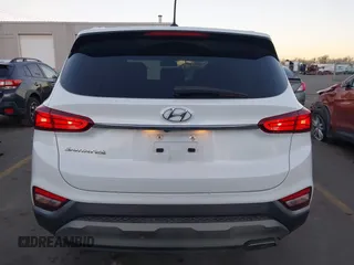 2019 Hyundai Santa Fe SE z VIN 5NMS23AD9KH077362, wystawiony jako IAAI lot #41890584 z przebiegiem 132 476 mil mil oraz . Historia ofert i sprzedaży dostępna na DreamBid. Obrazek 16.