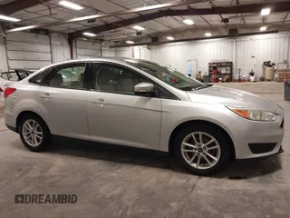 2017 Ford Focus SE z VIN 1FADP3F20HL245291, wystawiony jako IAAI lot #42194880 z przebiegiem 93 764 mil mil oraz . Historia ofert i sprzedaży dostępna na DreamBid. Obrazek 13.