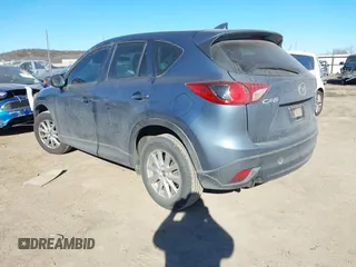 2016 Mazda CX-5 Sport with VIN JM3KE2BY3G0641895, listed as a IAAI auction lot 41689138 with 121,636 mi miles and . Bid and sale history available at DreamBid. Image 3.
