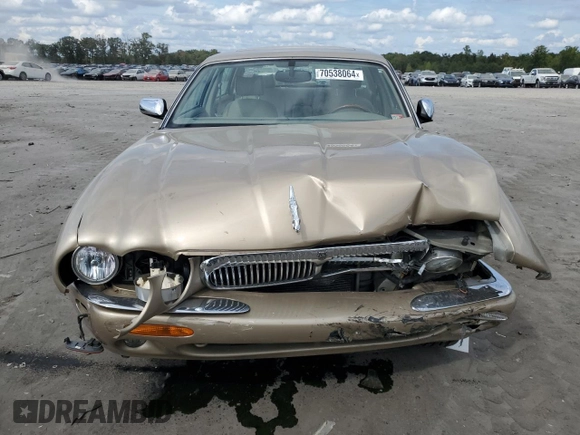 1999 Jaguar XJ z VIN SAJKX6048XC849376, wystawiony jako Copart lot #70538064 z przebiegiem 122 891 mil mil oraz Szkoda całkowita • Salvage title. Historia ofert i sprzedaży dostępna na DreamBid. Obrazek 5.