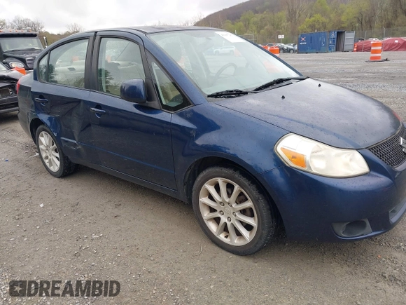 2011 Suzuki SX4 LE with VIN JS2YC5A23B6304713, listed as a IAAI auction lot 41997287 with 114,024 mi miles. Bid and sale history available at carsss.com. Image 1.
