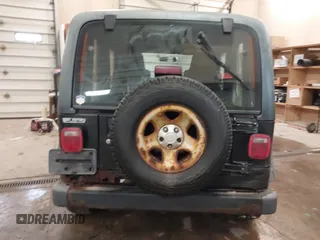 2003 Jeep Wrangler Sport Right Hand Drive with VIN 1J4F449S63P359031, listed as a IAAI auction lot 41495087 with 126,678 mi miles. Bid and sale history available at carsss.com. Image 16.