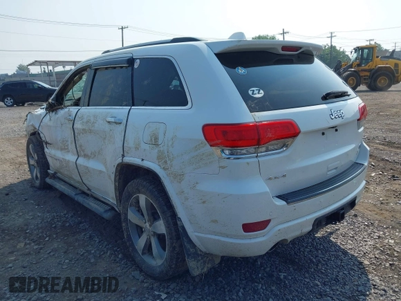 2015 Jeep Grand Cherokee Overland with VIN 1C4RJFCGXFC880096, listed as a IAAI auction lot 42706085 with 74,044 mi miles and . Bid and sale history available at DreamBid. Image 3.