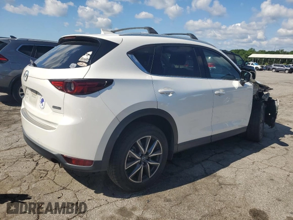 2018 Mazda CX-5 Grand Touring с VIN JM3KFADM3J1351532, выставлен на аукционе Copart как лот 55567405 с пробегом 99 134 миль миль и Списание • Salvage title. История ставок и продаж доступна на DreamBid. Изображение 3.