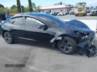 2022 Tesla Model 3 with VIN 5YJ3E1EA7NF314744, listed as a IAAI auction lot 42057596 with 30,936 mi miles and . Bid and sale history available at DreamBid. Image 13.