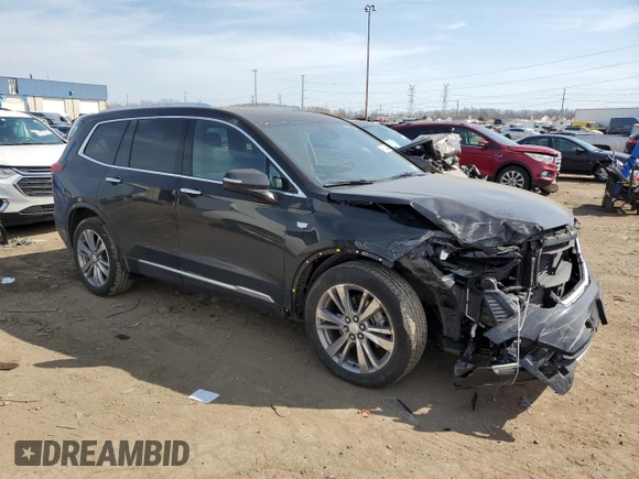 2023 Cadillac XT6 FWD Premium Luxury with VIN 1GYKPCRS4PZ103061, listed as a Copart auction lot 49300205 with 72,131 mi miles and Salvage title. Bid and sale history available at DreamBid. Image 4.