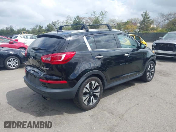 2013 Kia Sportage SX with VIN KNDPCCA61D7385219, listed as a IAAI auction lot 41945345 with 112,471 mi miles and . Bid and sale history available at carsss.com. Image 4.