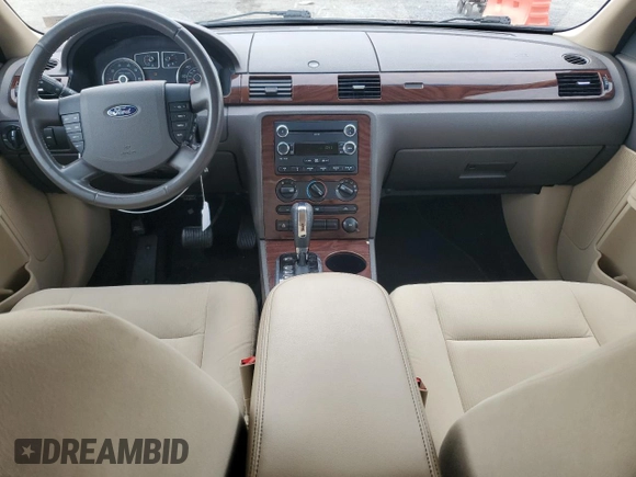 2009 Ford Taurus SE with VIN 1FAHP23W89G125025, listed as a Copart auction lot 80710004 with 114,176 mi miles and Salvage Title. Bid and sale history available at carsss.com. Image 8.