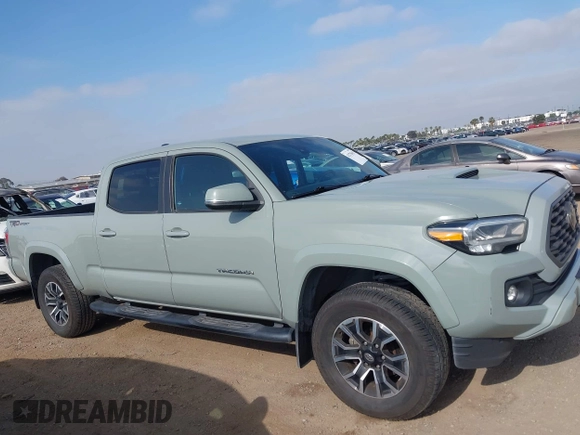 2022 Toyota Tacoma SR5 z VIN 3TMBZ5DN3NM034388, wystawiony jako IAAI lot #42270543 z przebiegiem 179 904 mil mil oraz . Historia ofert i sprzedaży dostępna na DreamBid. Obrazek 13.