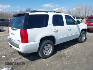 2009 GMC Yukon SLT w/4SA with VIN 1GKFK33059R282974, listed as a IAAI auction lot 42013219 with 209,240 mi miles. Bid and sale history available at carsss.com. Image 4.