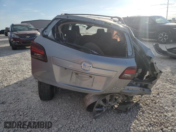 2015 Mazda CX-9 Grand Touring z VIN JM3TB2DA5F0468215, wystawiony jako Copart lot #53961975 z przebiegiem Nie podano mil oraz Szkoda całkowita • Salvage title. Historia ofert i sprzedaży dostępna na DreamBid. Obrazek 6.