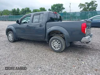 2015 Nissan Frontier SL with VIN 1N6AD0EV1FN764719, listed as a IAAI auction lot 42512771 with 104,572 mi miles and . Bid and sale history available at DreamBid. Image 3.