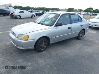 2002 Hyundai Accent GL with VIN KMHCG45C52U378454, listed as a IAAI auction lot 41418653 with 173,564 mi miles. Bid and sale history available at carsss.com. Image 2.